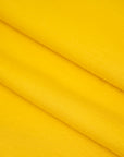 Yellow, stretchy jersey of viscose. High-quality deadstock fabric collected in Stock from a Maison de Couture in Italy.