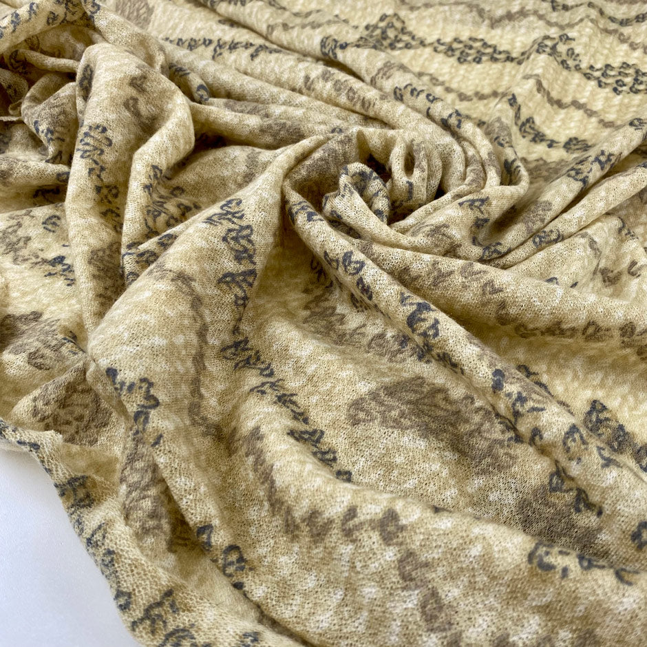 Very light pure wool jersey stretch with ethnic design in yellow and beige shades. Very soft and warm. High-quality deadstock fabric collected in Stock from a Maison de Couture in Italy.