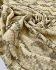 Very light pure wool jersey stretch with ethnic design in yellow and beige shades. Very soft and warm. High-quality deadstock fabric collected in Stock from a Maison de Couture in Italy.