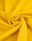 Yellow, stretchy jersey of viscose. High-quality deadstock fabric collected in Stock from a Maison de Couture in Italy.