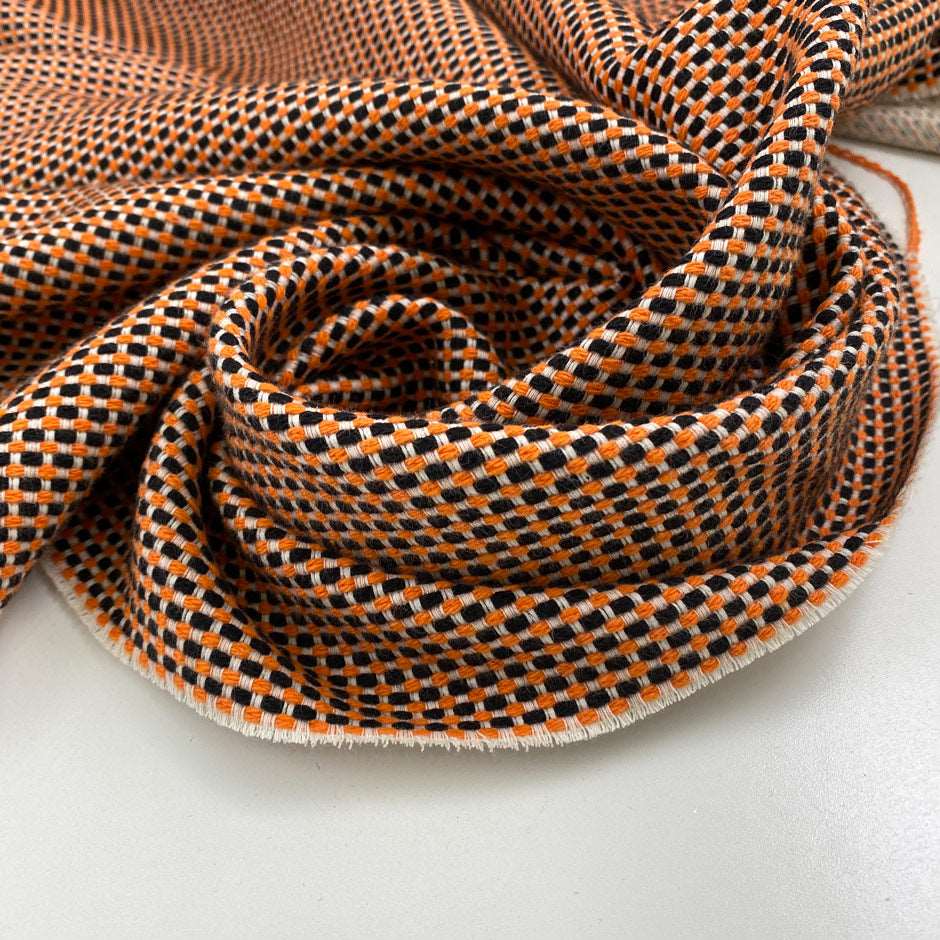Cotton and polyester jacquard tweed, heavy, textured orange fabric. High quality deadstock fabric collected in Stock from a Maison de Couture in Italy.