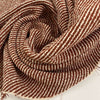 Orange and white cotton and viscose tweed. It feels droopy and stretchy. High quality deadstock fabric.&nbsp;