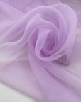 Lilac polyester organza very light and transparent, soft and flowy. High-quality deadstock fabric collected in Stock from a Maison de Couture in Italy.