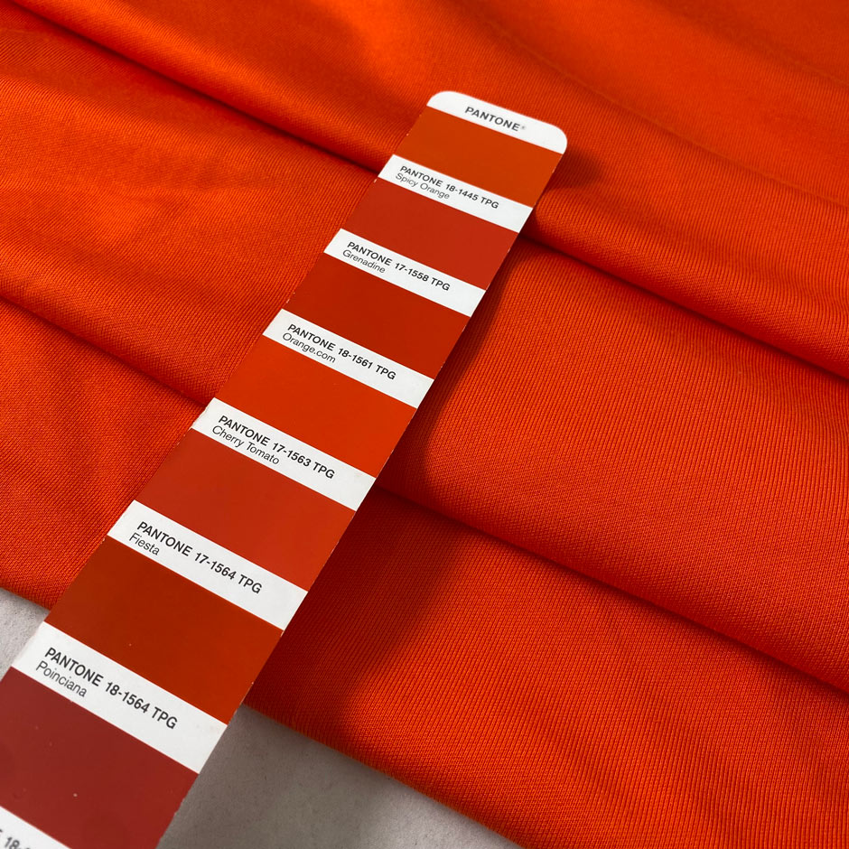 Orange cotton and viscose technical piquet jersey in cherry tomato shade soft stretchy and fluid. Ideal for sweatshirts, trousers, skirts and jackets. High-quality deadstock collected in Stock from a Maison de Couture in Italy.