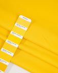 Yellow, stretchy jersey of viscose. High-quality deadstock fabric collected in Stock from a Maison de Couture in Italy.