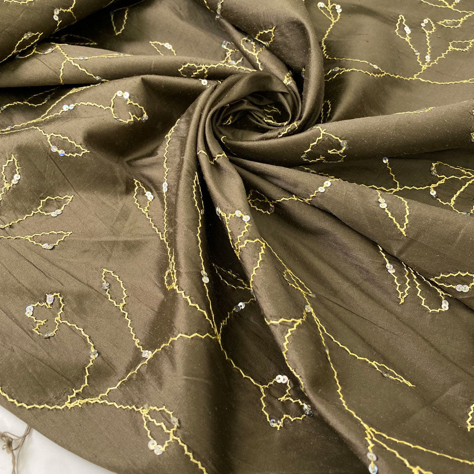 Green silk with floral embroidery and delicate sequins. Slightly stiff, it adds volume and holds shape. Perfect for jackets, dresses, and skirts.High-quality deadstock collected in Stock from a Maison de Couture in Italy.