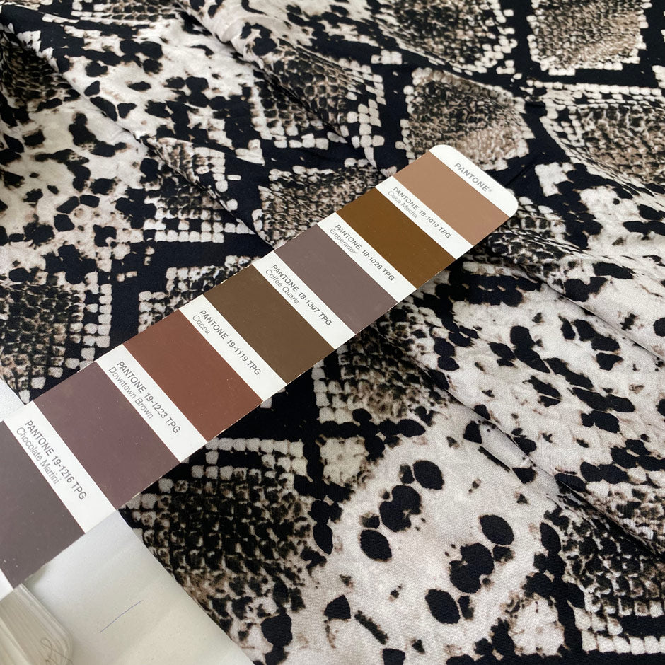 Pure viscose with a snake skin print in beige, black, and mocha tones. Very soft, light, and flowy, not transparent. Ideal for blouses, shirting, dresses, and skirts. High-quality deadstock collected in Stock from a Maison de Couture in Italy.