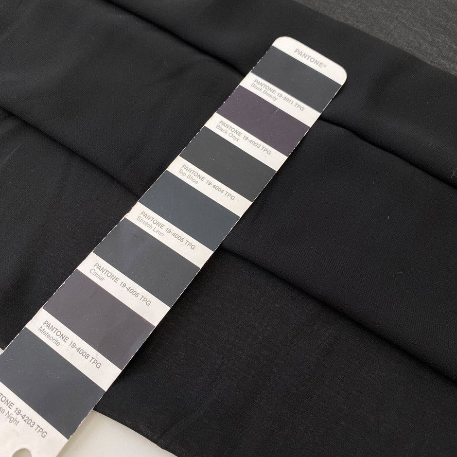 Polyester georgette in black. Very light, soft, and flowy with transparent finish. Ideal for shirting, dresses, and skirts. High-quality deadstock collected in Stock from a Maison de Couture in Italy.