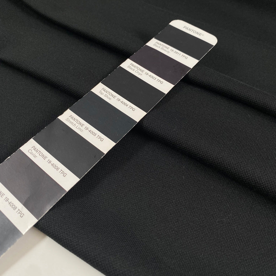 Black polyester jersey soft breathable versatile fabric ideal for everyday garments and activewear. High-quality deadstock collected in Stock from a Maison de Couture in Italy.