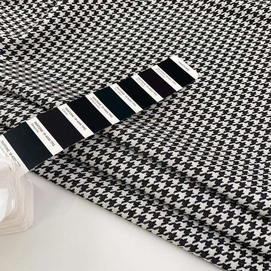 Soft and structured, black and white, viscose and polyamide fabric witha geometric pattern. High quality deadstock fabric.
