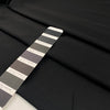 Polyester heavy twill in black, very soft with a shiny effect.