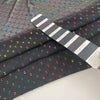 Transparent fil coupé in black background polyester. High-quality deadstock fabric by the meter collected in Stock from a Maison de Couture in Italy.