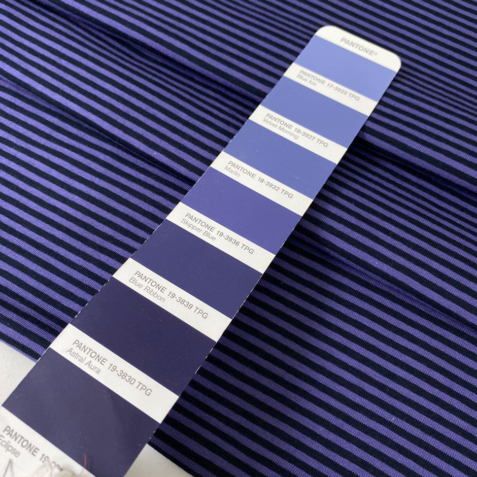 Striped cotton jersey in purple and black, soft and light with a natural stretch. Perfect for t-shirts, dresses, trousers, and skirts. High-quality deadstock collected in Stock from a Maison de Couture in Italy.