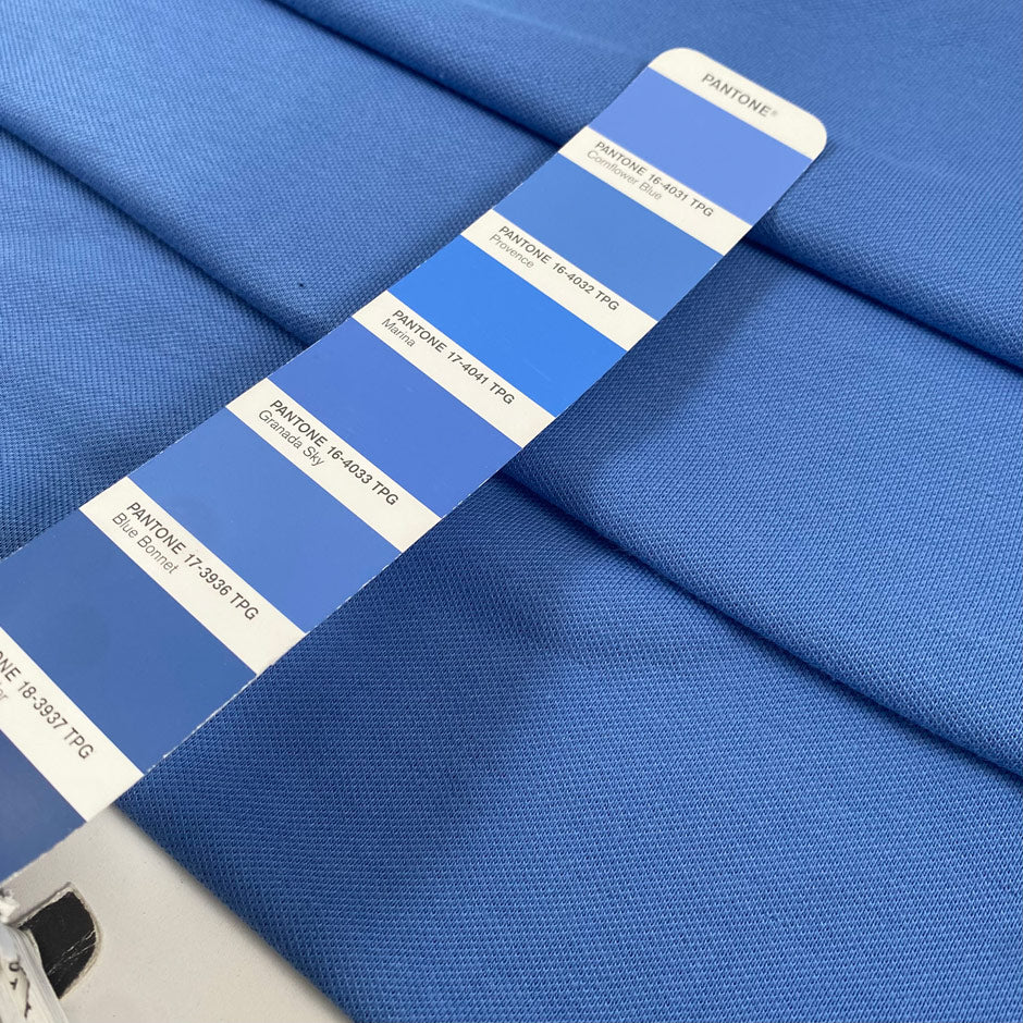 Pure cotton stretch jersey piquet in light blue color reference Cornflower Blue. Soft, textured, and comfortable. Ideal for dresses, trousers, and skirts. High-quality deadstock collected in Stock from a Maison de Couture in Italy.