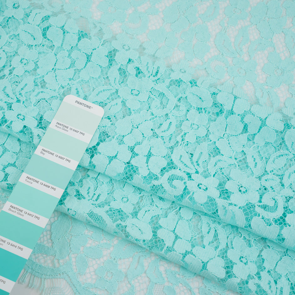 Light blue water lace polyamide and viscose. Transparent and falling. High-quality deadstock fabric collected in Stock from a Maison de Couture in Italy.