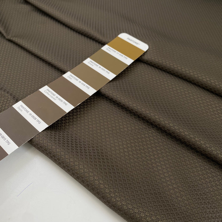 Polyester jacquard in dark brown with an ultra-small pattern, very soft, light, and slightly shiny, ideal for dresses, shirts, and fluid tailoring. High-quality deadstock collected in Stock from a Maison de Couture in Italy.