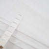 White and stretched cotton jersey. High-quality deadstock fabric collected in Stock from a Maison de Couture in Italy.