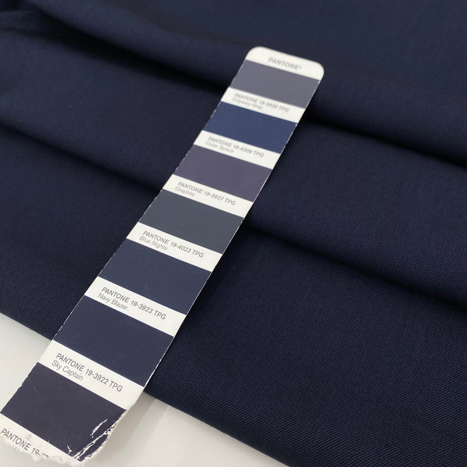 Mixed wool and linen stretch gabardine in dark blue color reference Outer Space. Very soft and flowy, ideal for trousers, skirts, jackets, and dresses. High-quality deadstock collected in Stock from a Maison de Couture in Italy.