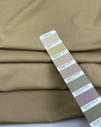 Beige stretch wool and very soft. Perfect for trousers. High-quality deadstock collected in Stock from a Maison de Couture in Italy.