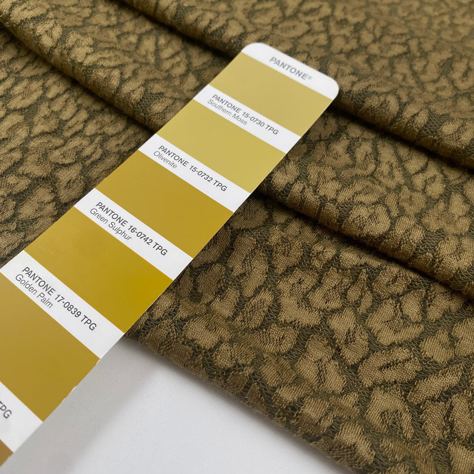 Green spotted wool jersey warm soft and slightly stretchy ideal for cozy tops dresses and light outerwear. High-quality deadstock collected in Stock from a Maison de Couture in Italy.