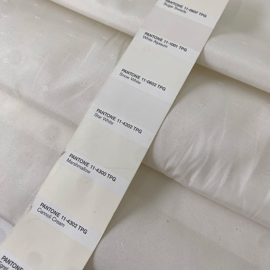 Cotton, polyester and elastane blend in white Marshmallow. Soft, not transparent, with a subtle micro texture. Ideal for trousers, dresses and skirts. High-quality deadstock collected in Stock from a Maison de Couture in Italy.