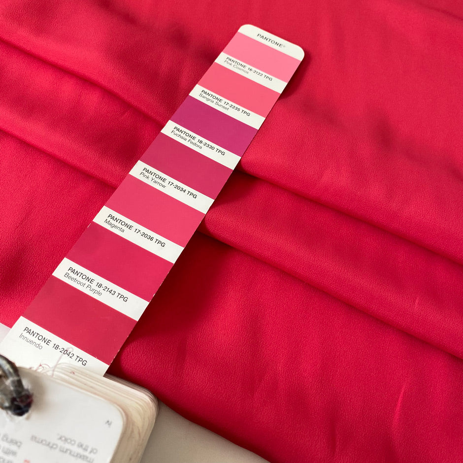 Silk and acetate crepe de chine in fuchsia color, reference Innuendo. Very soft, light and flowy, not transparent. Ideal for shirting, blouses, dresses, and skirts. High-quality deadstock collected in Stock from a Maison de Couture in Italy.