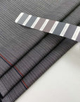 Gray and white stretch wool pinstripes. High quality deadstock fabric.