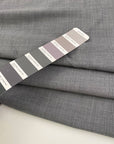 Gray and white stretchy and textured wool tweed. High quality deadstock fabric.