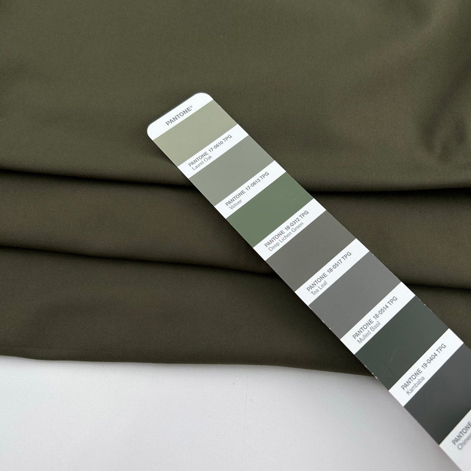 Green bielastic cotton gabardine, ideal for trousers. High-quality deadstock collected in Stock from a Maison de Couture in Italy.