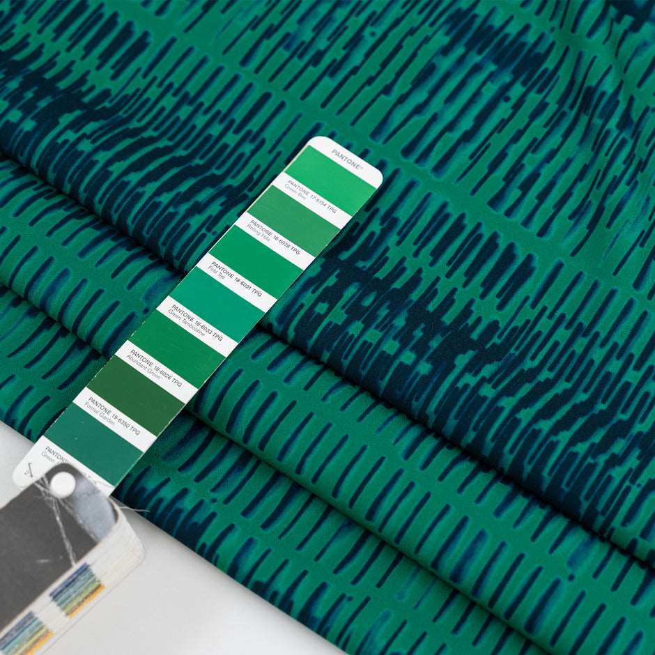 Cady polyester patterned green and blue. High quality deadstock fabric.