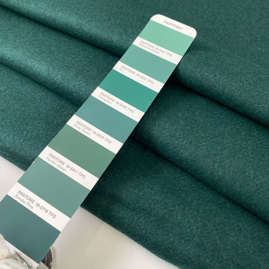 Heavy wool and polyester mix in dark green, shade Posy green. Very soft and warm, ideal for jackets and coats. High-quality deadstock collected in Stock from a Maison de Couture in Italy.