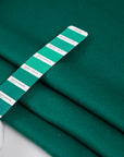 Green soft coat made of virgin wool and cashmere. High quality deadstock fabric.