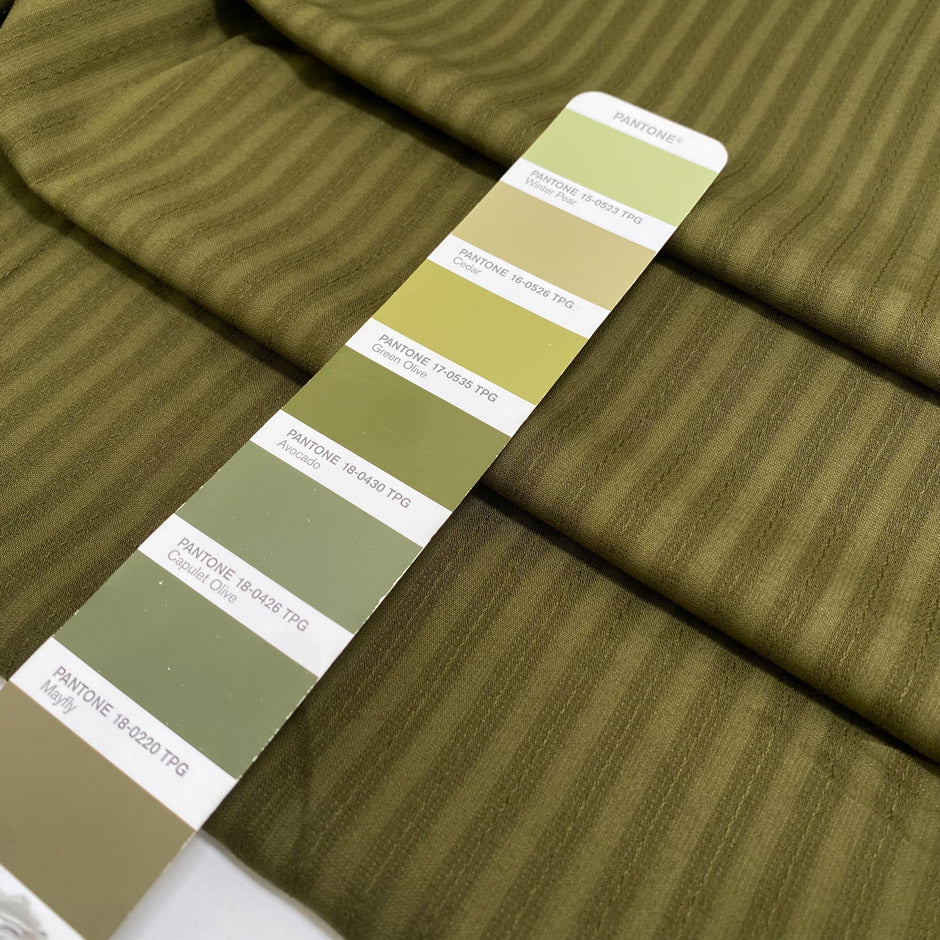 Pure cotton jacquard in avocado green with refined stripe design. Versatile and elegant, ideal for dresses, skirts, and trousers.&nbsp;High-quality deadstock collected in Stock from a Maison de Couture in Italy.