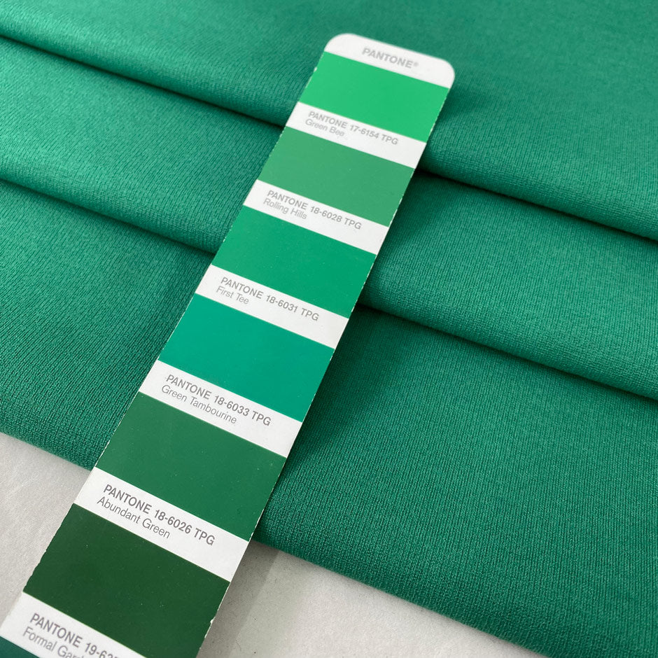 Viscose and elastane stretch Punto Milano jersey in green color reference Rolling Hills. Very soft and flowy, slightly heavy, ideal for trousers, skirts, jackets, and dresses. High-quality deadstock collected in Stock from a Maison de Couture in Italy.