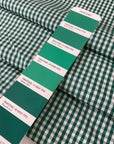 Pure cotton poplin with a small check design in shades of white and green. Very soft and light. Ieal for dresses, shirting, and skirts. High-quality deadstock collected in Stock from a Maison de Couture in Italy.