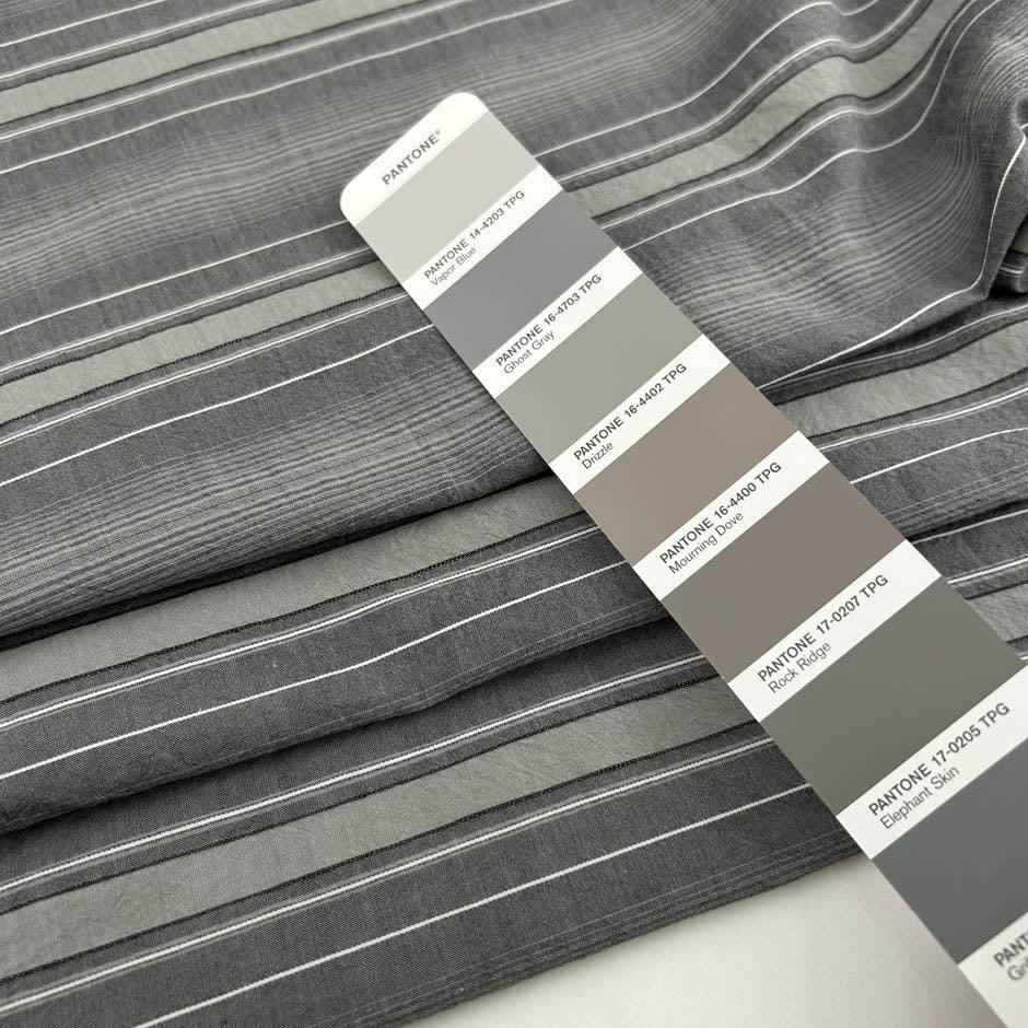 Gray striped cotton jacquard with an irregular pattern, soft and non-stretch. High-quality deadstock collected in Stock from a Maison de Couture in Italy.