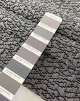 Jacquard fabric in gray with textured surface. A soft and heavy mix of polyester, viscose, and wool, ideal for light coats, jackets, dresses, and skirts. High-quality deadstock collected in Stock from a Maison de Couture in Italy.