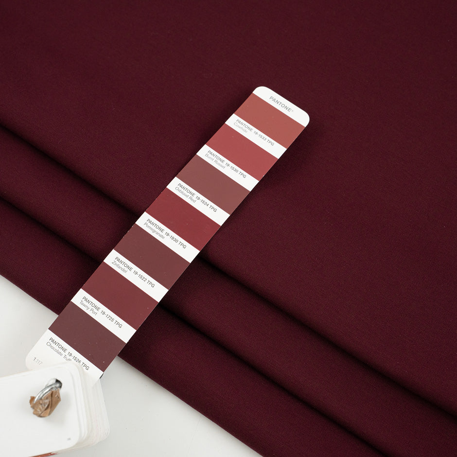 Punto Milano jersey of viscose and poliammide. The fabric is heavy, Stretch and bordeaux. High-quality deadstock collected in Stock from a Maison de Couture in Italy.