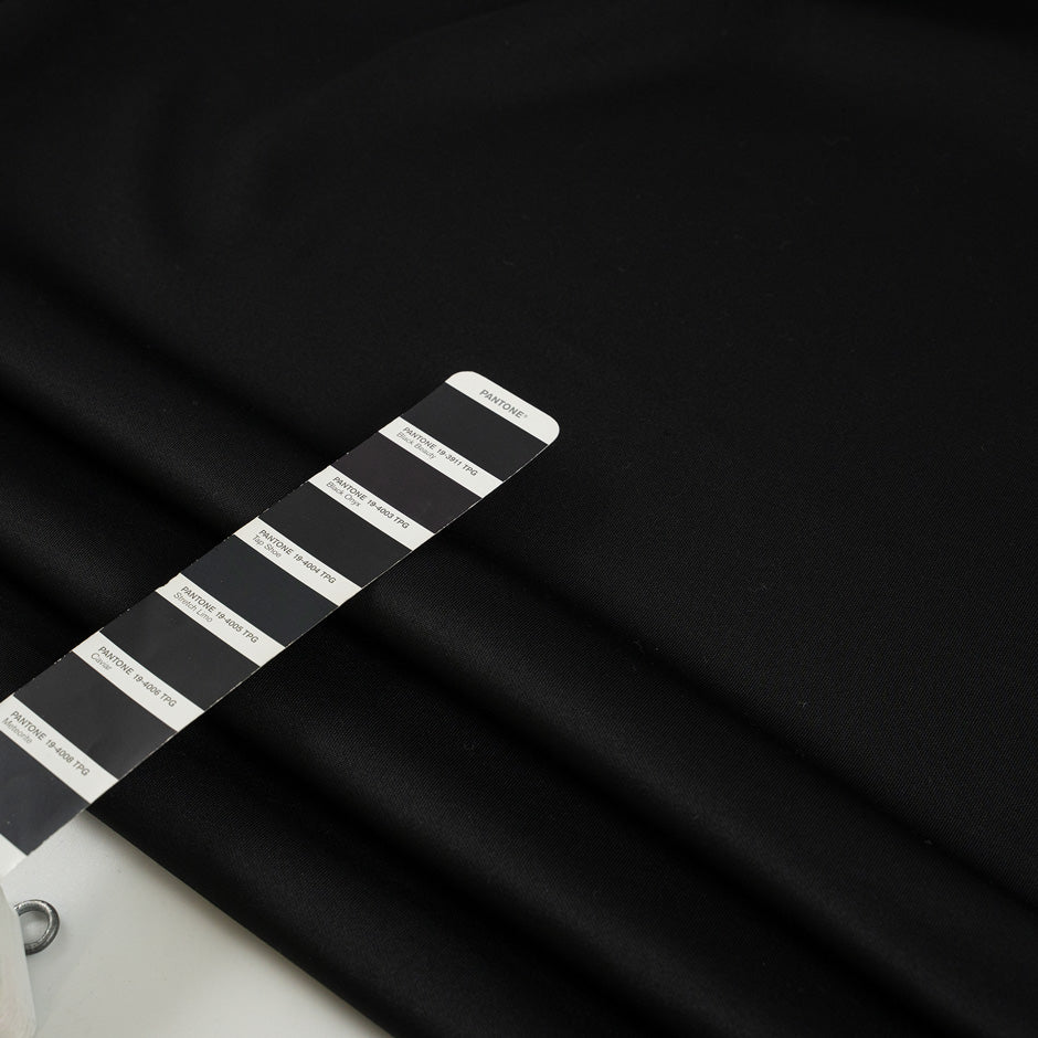 Black cotton polyester jersey, stretch and falling. High-quality deadstock fabric collected in Stock from a Maison de Couture in Italy.