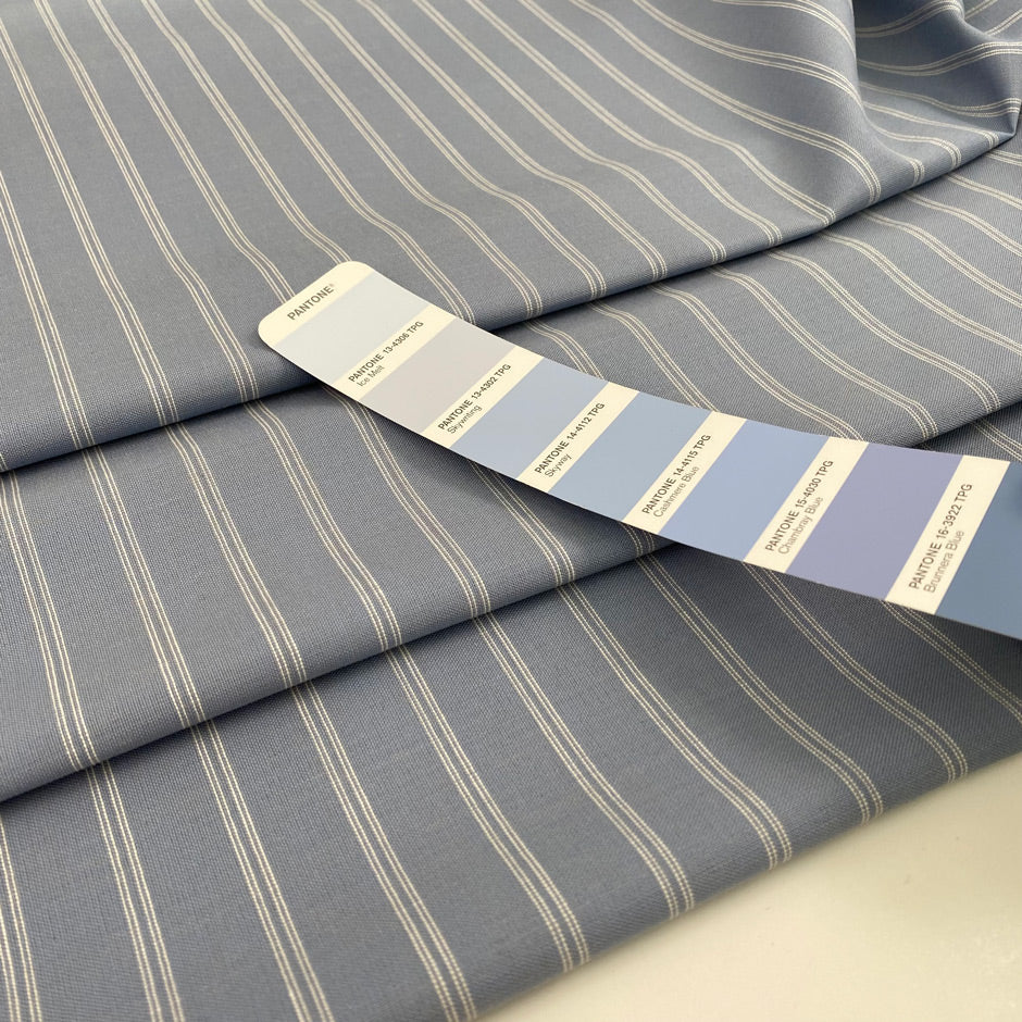 Blue pinstripe pure wool. High-quality deadstock fabric collected in Stock from a Maison de Couture in Italy.