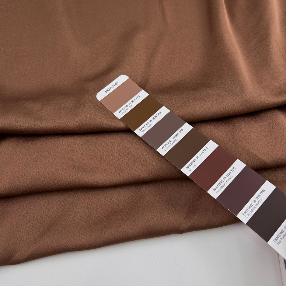 Light brown hammered polyester satin, soft and non-stretch. High-quality deadstock collected in Stock from a Maison de Couture in Italy.