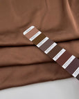 Light brown hammered polyester satin, soft and non-stretch. High-quality deadstock collected in Stock from a Maison de Couture in Italy.