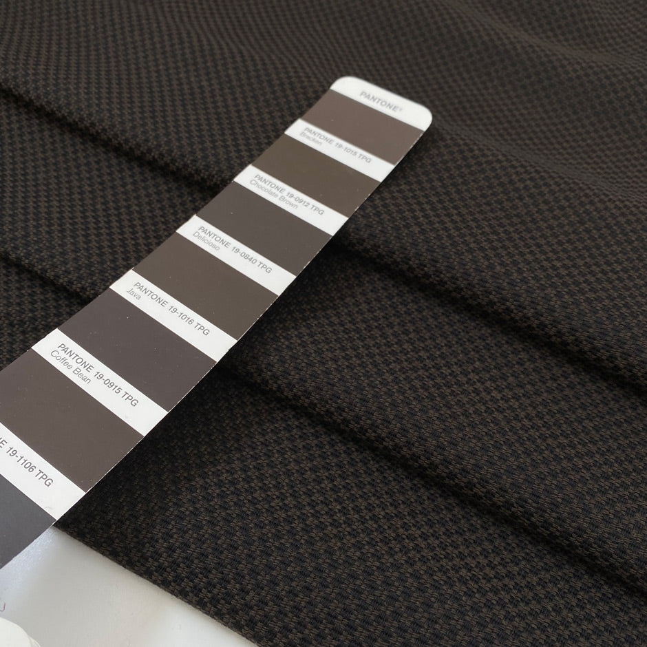 Wool, polyester, and cotton with textured, very soft, and warm. In the shades of dark brown and black. High-quality deadstock fabric by the meter collected in Stock from a Maison de Couture in Italy.