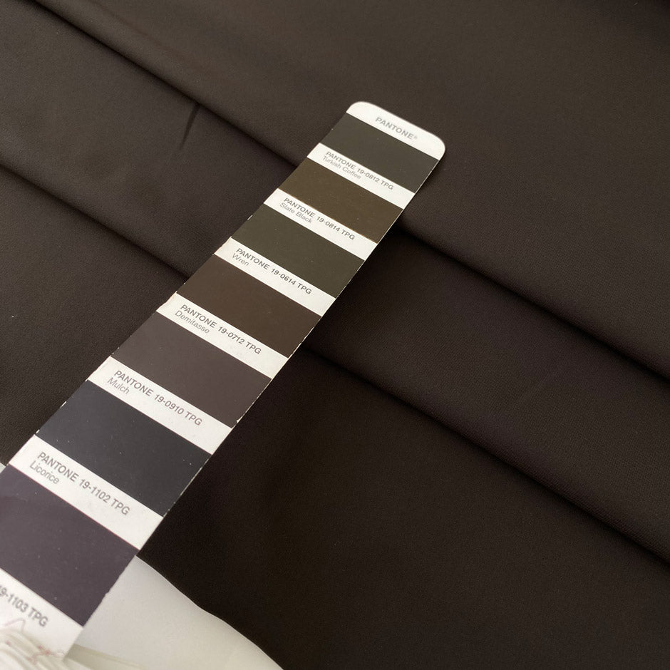 Dark brown polyester crepe, soft and fluid . Perfect dresses, skirts, blouses and shirts. High-quality deadstock collected in Stock from a Maison de Couture in Italy.
