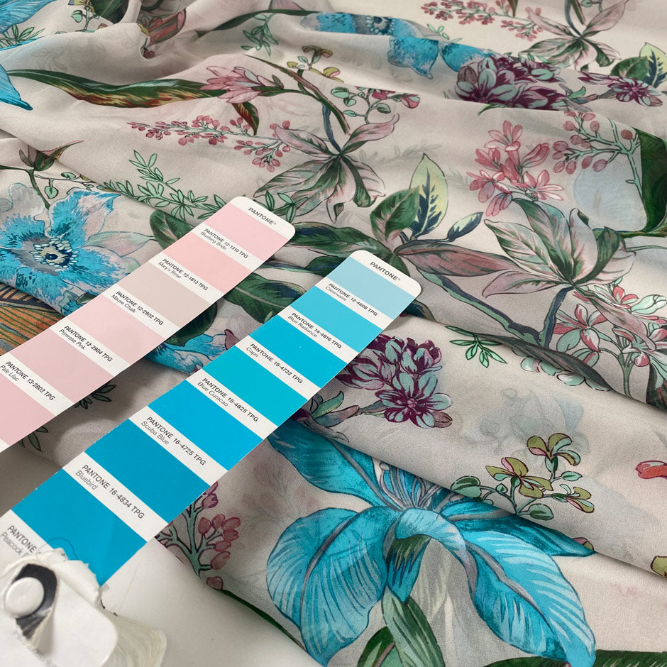 Polyester chiffon printed with floral and leaf design in shades of pink, green, and light blue. Very light, flowy, and transparent. High-quality deadstock collected in Stock from a Maison de Couture in Italy.