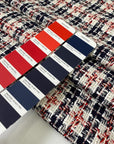 Cotton tweed with a white ground and check design in the shades of dark blue and red. Very soft and light. Ideal for jackets, skirts, and dresses. High-quality deadstock collected in Stock from a Maison de Couture in Italy.