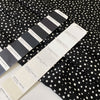 Pure silk crêpe de chine, very soft and light, with a black and white polka dot print. Not transparent and very flowy. Ideal for shirting, dresses, and skirts. High-quality deadstock collected in Stock from a Maison de Couture in Italy.