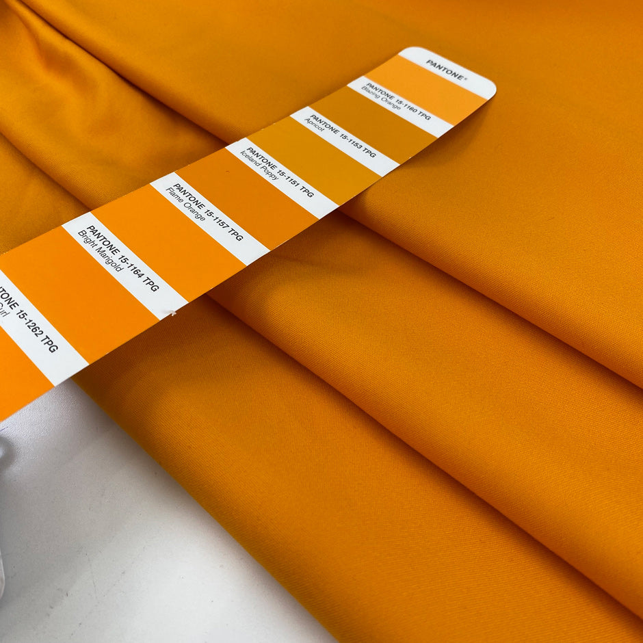 Heavy and soft cotton with elastane, in apricot orange. High-quality deadstock fabric collected in Stock from a Maison de Couture in Italy.