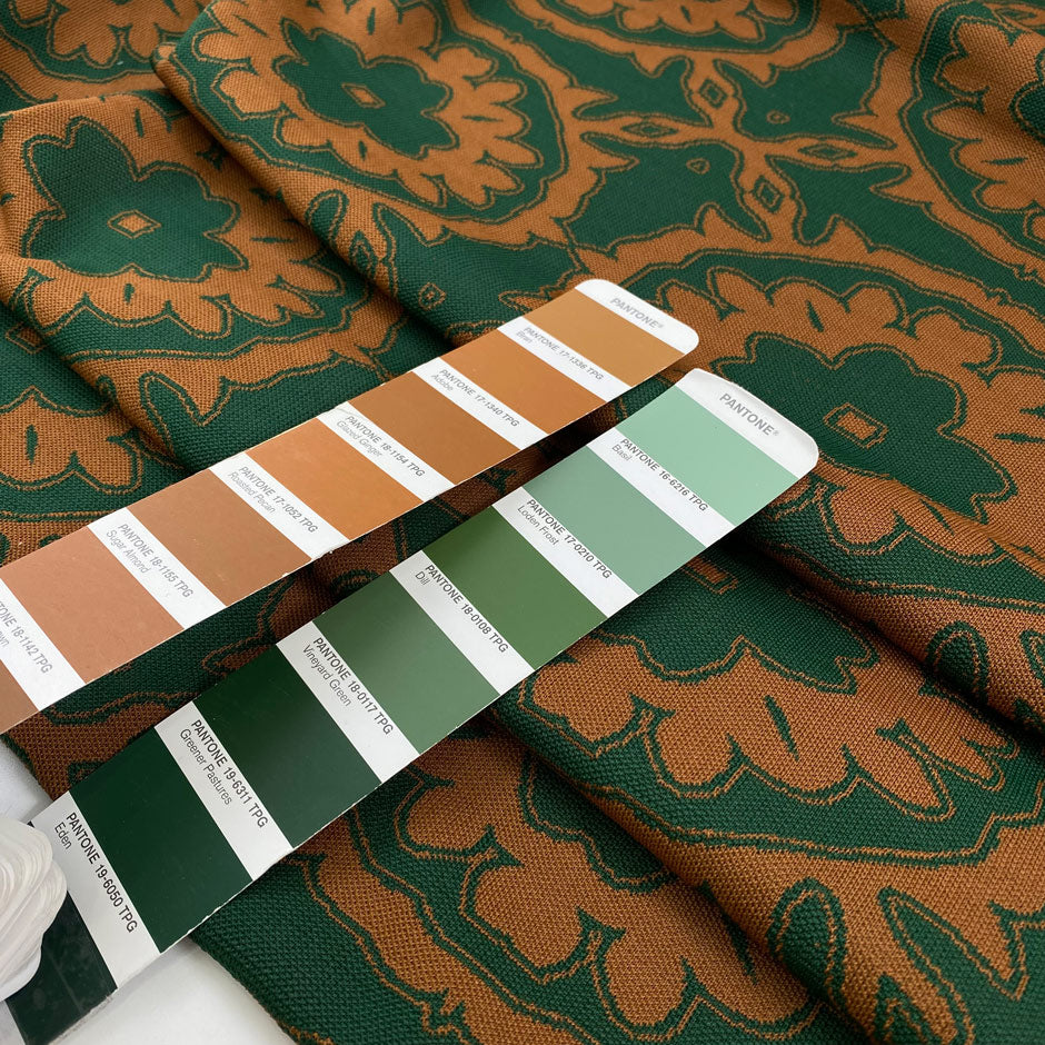 Heavy polyester elastane Punto Milano jersey with a beautiful paisley design in the shade forest green and leather brown. Ideal for structured dresses and tops. High-quality deadstock collected in Stock from a Maison de Couture in Italy.