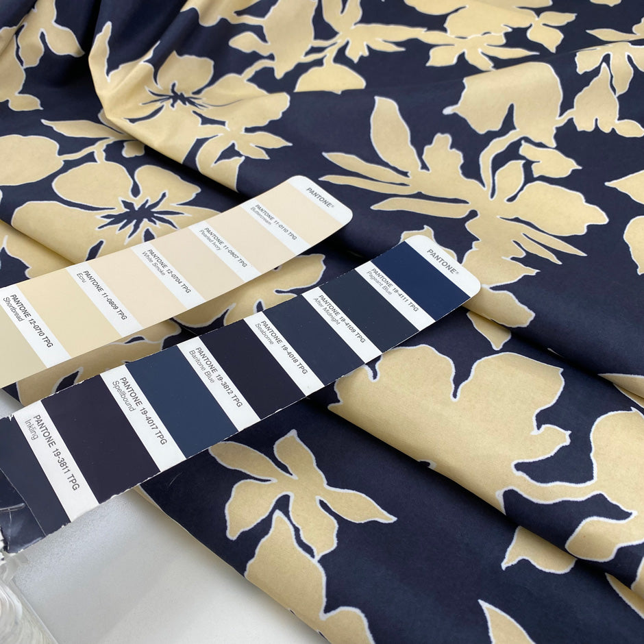 Printed polyester cinzato with floral design in dark blue, ecru, and yellow, very crunchy and not transparent, ideal for structured garments and bold pieces. High-quality deadstock collected in Stock from a Maison de Couture in Italy.